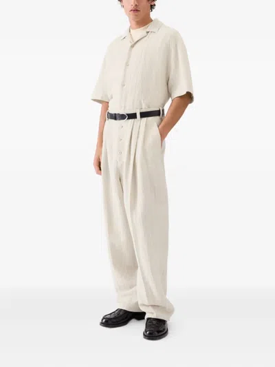 Jacquemus Le Fernando Button-front Pleated Trousers In Neutral