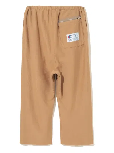 Undercover Logo-patch Raw-edge Pants In Brown