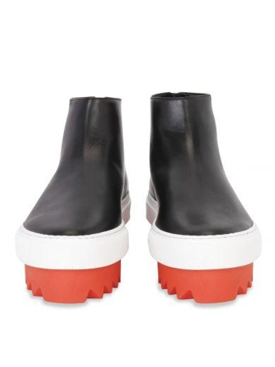 Shop Givenchy Ridged Sole Ankle Boots In Black / Orange