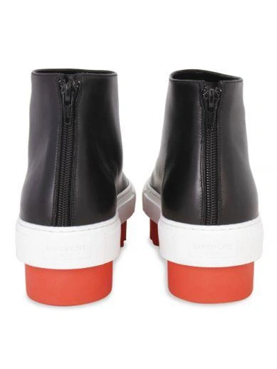 Shop Givenchy Ridged Sole Ankle Boots In Black / Orange