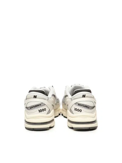 New Balance Grey Low Top Sneakers With Logo Patch On Side And Tongue And Perforated Panels In White
