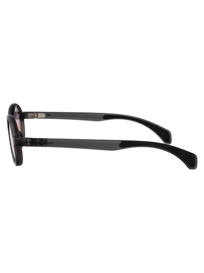 Moncler Matte Transparent Grey Injectate Sunglasses In Black