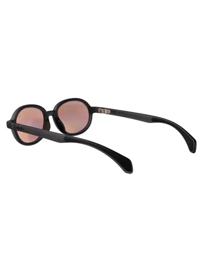 Moncler Matte Transparent Grey Injectate Sunglasses In Black
