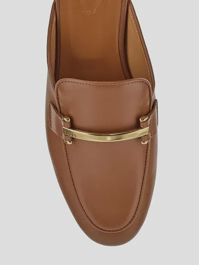 Tod's Flat Leather Mules In Brown