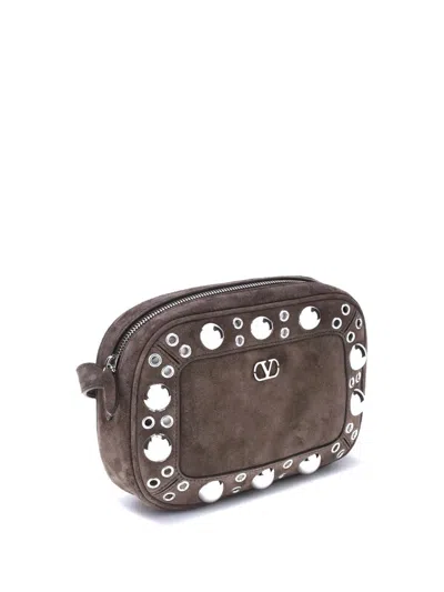 Valentino Garavani Dome-shaped Crossbody Bag With Metallic Eyelets And Adjustable Strap