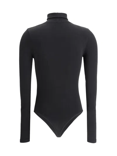 Wolford Seamless Fitted Turtleneck Long-sleeved Top In Black