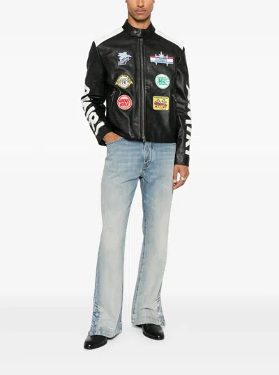 Amiri Light Blue Jeans With Flared Leg And Logo Patch On The Rear In Blue