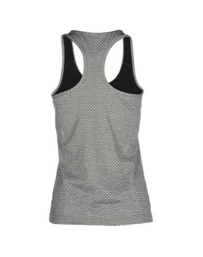 Shop Puma Sports Bras And Performance Tops In Grey