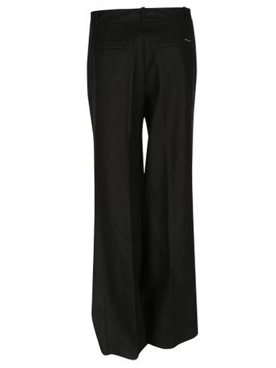 Shop Michael Michael Kors High Waisted Flared Trousers In Black