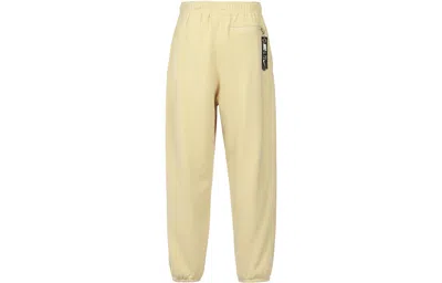 Nike Logo French Terry Pants In Yellow