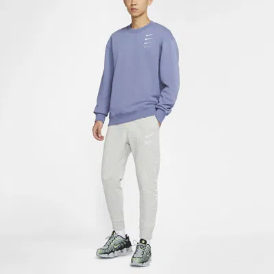 Nike Sportswear Swoosh Logo Slim Fit Bundle Feet Sports Long Pants Gray