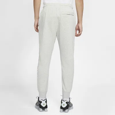 Nike Sportswear Swoosh Logo Slim Fit Bundle Feet Sports Long Pants Gray