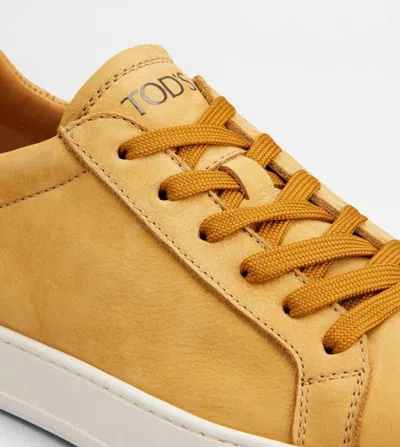 Tod's Low Top Round Toe Rubber Sole Sneakers In Orange