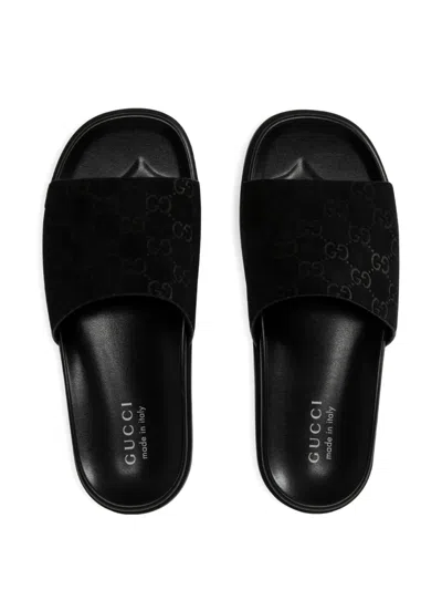 Gucci Men Leather Slides With All-over Gg Motif In Black