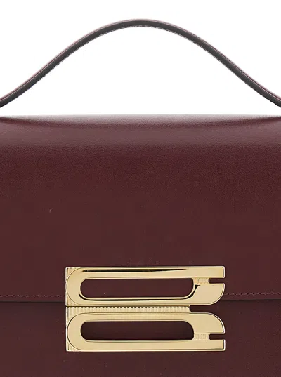 Victoria Beckham 'dorian' Bordeaux Shoulder Bag With Adjustable And Removable Shoulder Strap And Log