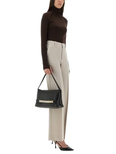 Victoria Beckham Slim-fit Turtleneck Shirt In Rich Merino Wool In Brown