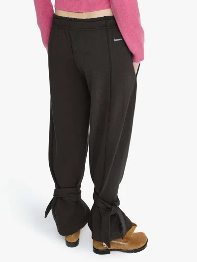 Jw Anderson Tie-fastening Cuffed Trousers In Brown
