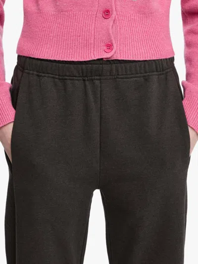 Jw Anderson Tie-fastening Cuffed Trousers In Brown