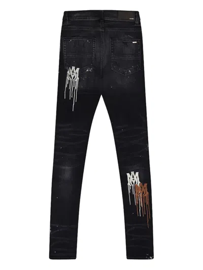 Amiri Aged Black Ma Stencil Jeans In Black