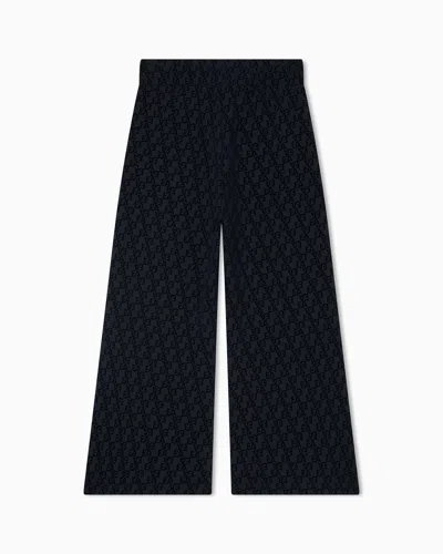 Emporio Armani Interlock Jersey Trousers With All-over Flocked Ea Logo In Black