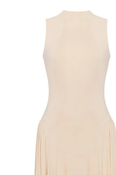 Milla Nude Sleeveless Mock Neck Dress With A Pleated Maxi Skirt