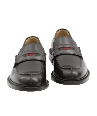 Gucci Web-stripe Leather Loafers In Black