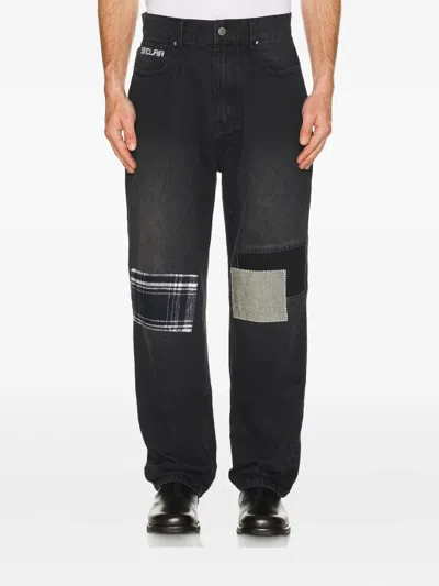 Sinclair Patchwork Panel Jeans In Black