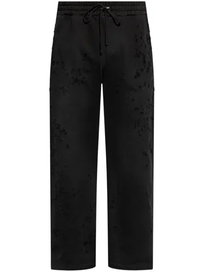 Amiri Distressed Finish Straight-legged Jogging Trousers In Black