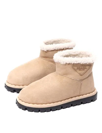 Prada Triangle-logo Suede Boots In Gold