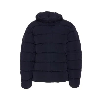 C.p. Company Blue Down Jacket With Fixed Hood And Logo Plaque On The Sleeve In Tech Fabric Man In Blue