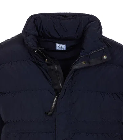 C.p. Company Blue Down Jacket With Fixed Hood And Logo Plaque On The Sleeve In Tech Fabric Man In Blue