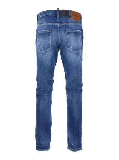 Dsquared2 Blue Jeans With Ripped Details And Logo Patch On The Rear In Denim Man In Blue