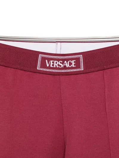 Versace Stirrup-leg Trousers In Burgundy