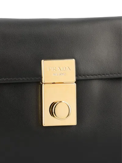 Prada Soft Sound Small Leather Shoulder Bag With Charms In Black