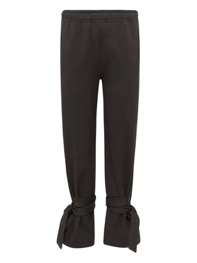 Jw Anderson Tie-fastening Cuffed Trousers In Black