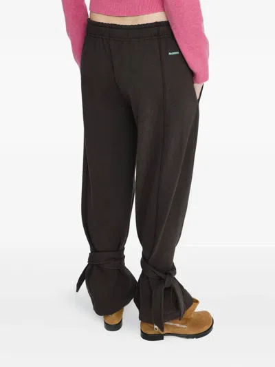 Jw Anderson Tie-fastening Cuffed Trousers In Black