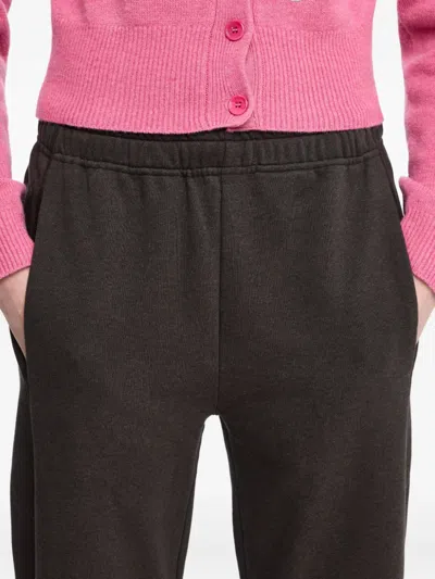 Jw Anderson Tie-fastening Cuffed Trousers In Black