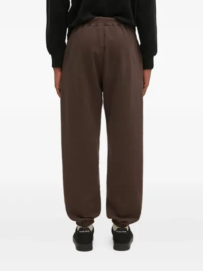 Aries Slogan-print Sweatpants In Brown