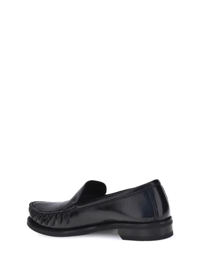 Prada Polished Leather Flat Shoes In Black
