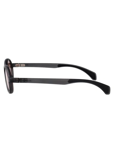 Moncler Matte Transparent Grey Injectate Sunglasses In Black