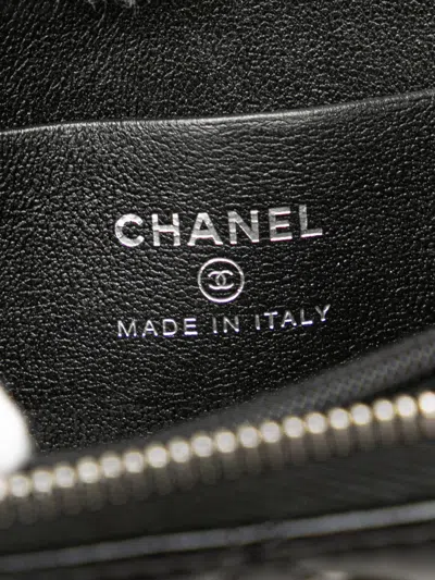 Pre-owned Chanel 2021-2025 Quilted Lambskin Cc Crystal Coin Pouch In Black