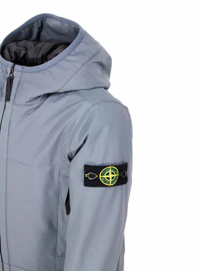 Stone Island Padded Jacket With Hood In Technical Fabric Made With Recycled Bottles E.dye Technology With Primalo In Blue