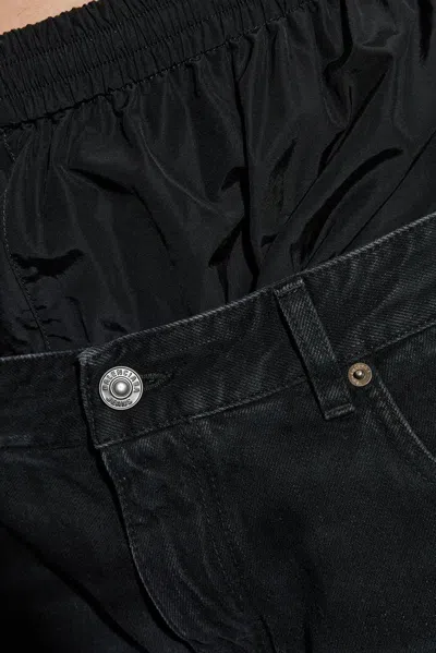 Balenciaga Layered Shell-trimmed Distressed Flared Jeans In Black