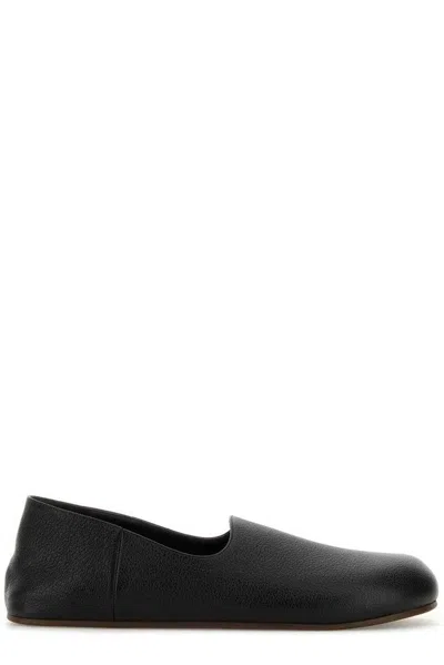 The Row Black Leather Hugh Slip-ons