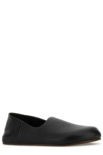 The Row Black Leather Hugh Slip-ons