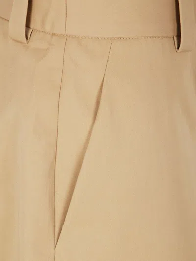 Khaite Cotton Straight-leg Trousers In Yellow