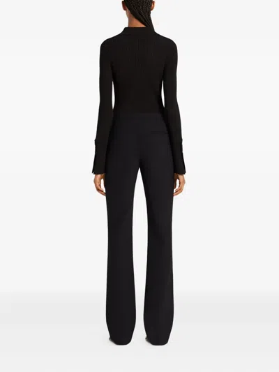 Courrèges Geripptes Poloshirt