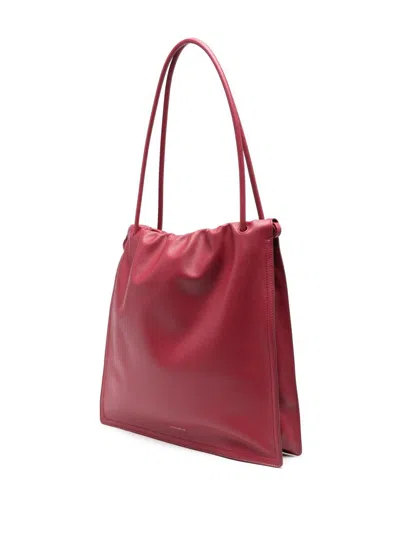 Coccinelle Logo Embossed Drawstring Tote Bag In Red