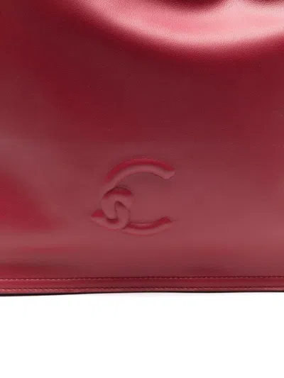 Coccinelle Logo Embossed Drawstring Tote Bag In Red