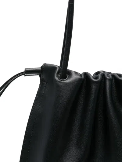 Coccinelle Black Vitello Leather Handbag With Drawstring Closure